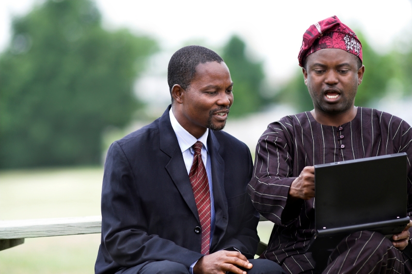 two African men studying