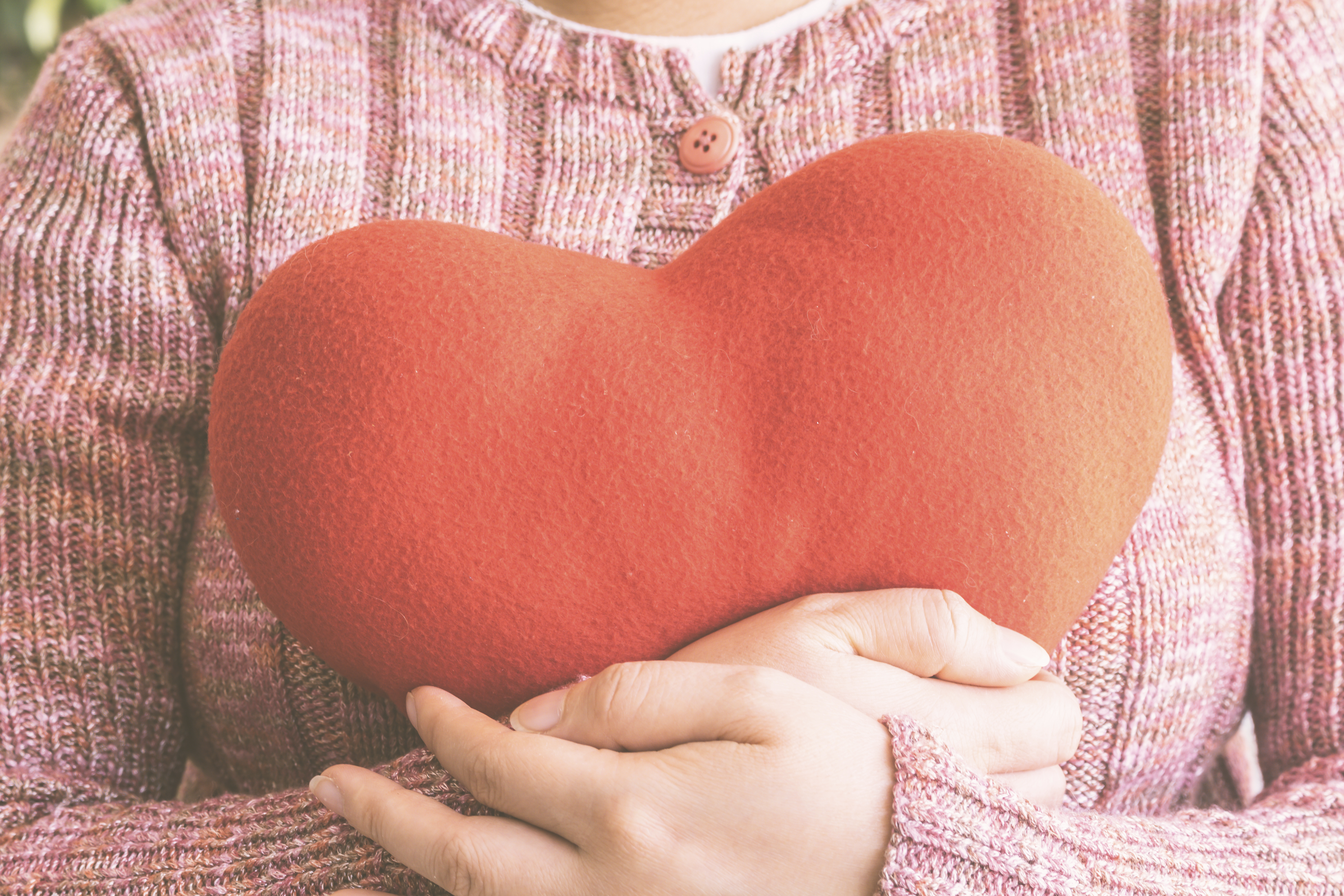 woman holding heart