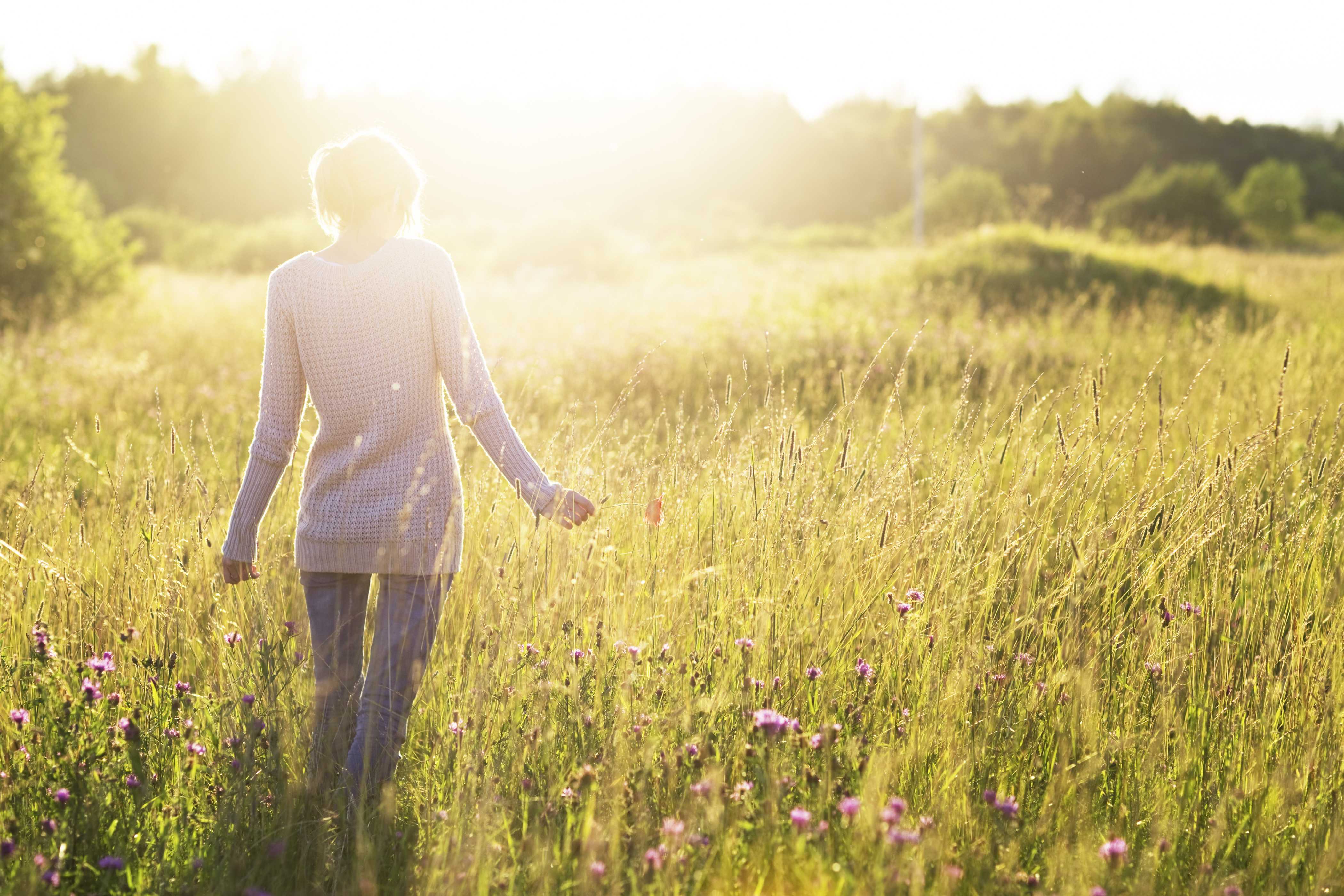 woman walking in sunshine